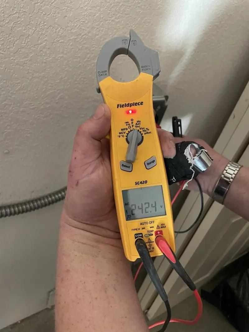 Voltage testing with clamp meter during Electrical Installation Services in Brightwaters